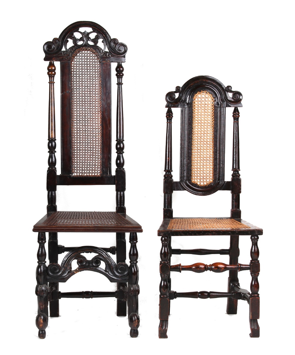 Property of a lady - two similar late 17th century carved walnut & cane panelled high-back chairs (