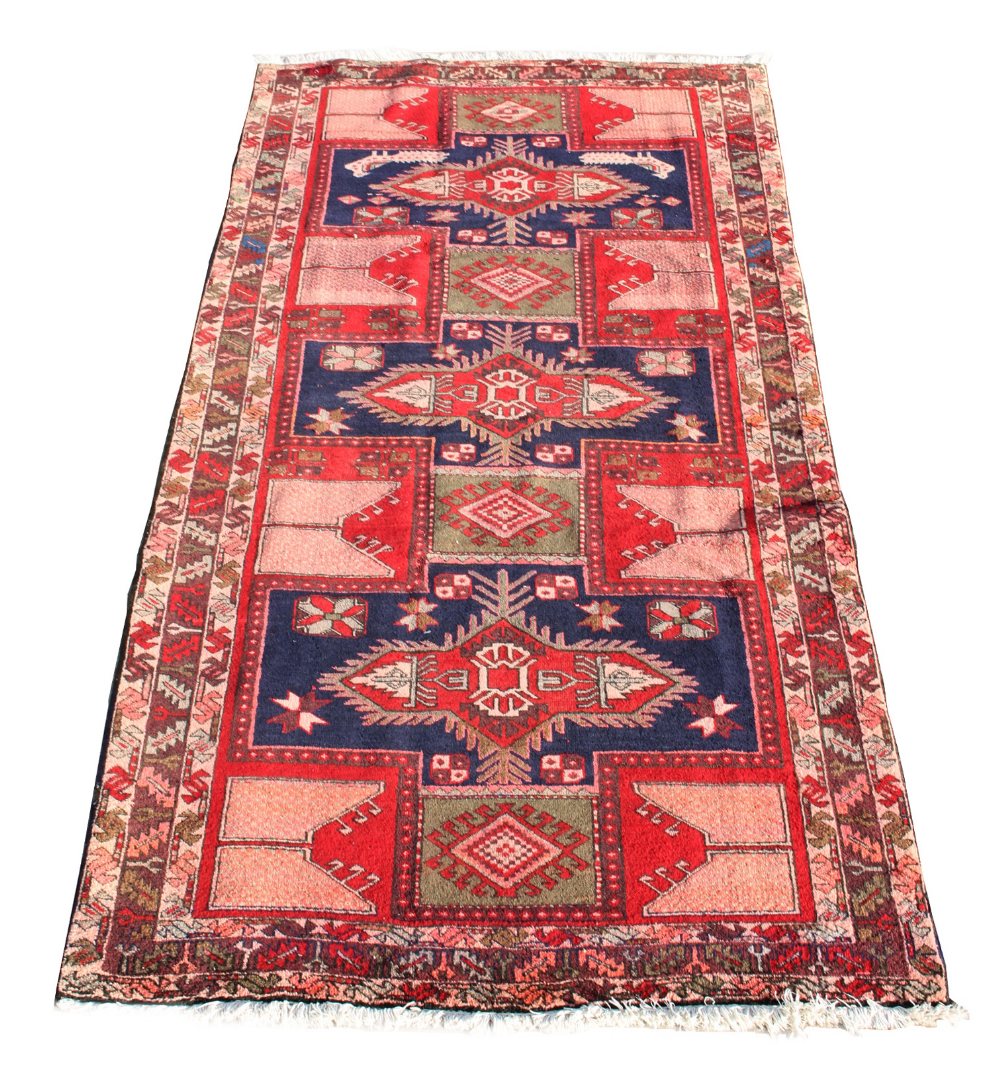 An Ardebil woollen hand-made runner with geometric design, 126 by 57ins. (320 by 145cms.) (see