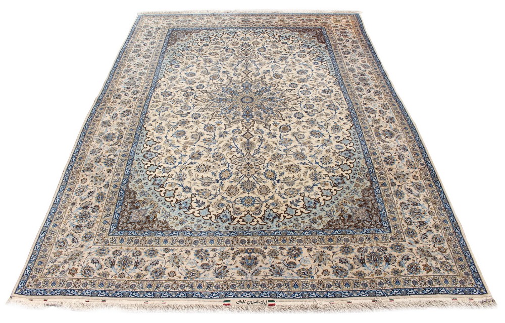 Property of a gentleman - a fine Persian Isfahan part silk carpet, with ivory ground, signature