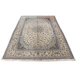 Property of a gentleman - a fine Persian Isfahan part silk carpet, with ivory ground, signature
