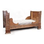 Property of a gentleman - a late 19th century & later French chestnut bed, with carved floral