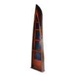 Property of a gentleman - a bookcase adapted from the bow of an early 20th century wooden rowing