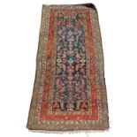 Property of a lady - an early 20th century Hamadan long rug, 94 by 45ins. (239 by 115cms.) (see