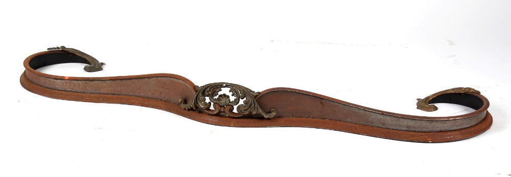 Property of a lady - an early 19th century brass & steel scroll shaped fire curb, 58.5ins. (148.