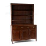An early 20th century oak two-part dresser, 53.25ins. (135.5cms.) wide (overall) (see