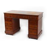 Property of a lady - a late 19th / early 20th century twin pedestal desk with nine drawers, 47.25