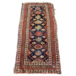 Property of a gentleman - a mid 19th century Northwest Persian rug, reduced in length, damages, 84