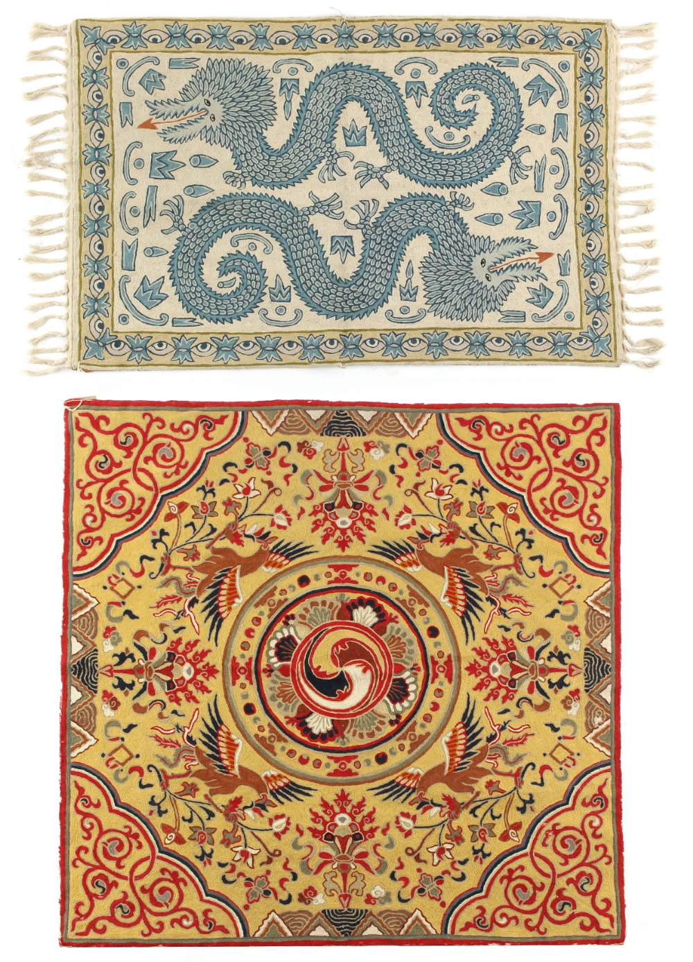 Two crewel work rugs in the Chinese taste, the larger with four phoenixes on a yellow ground, the