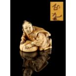 The Ronald Hart Collection of Japanese Netsukes - a carved ivory netsuke modelled as a man