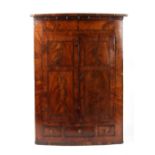 Property of a gentleman - a George III mahogany & rosewood banded bow-fronted two-door corner wall