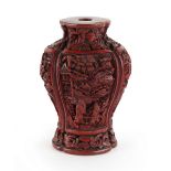 Property of a lady - a well carved Chinese cinnabar lacquer snuff bottle of lobed oval baluster