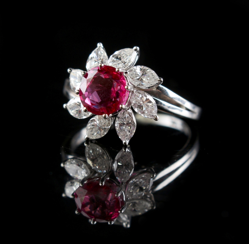 An 18ct white gold ruby & diamond flowerhead cluster ring, the fine round cut certificated untreated