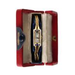 An Art Deco 18ct yellow gold tank cased wristwatch, the case set with calibre cut sapphires, with