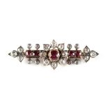 A late 19th / early 20th century ruby & diamond brooch with centre flowerhead, set with five