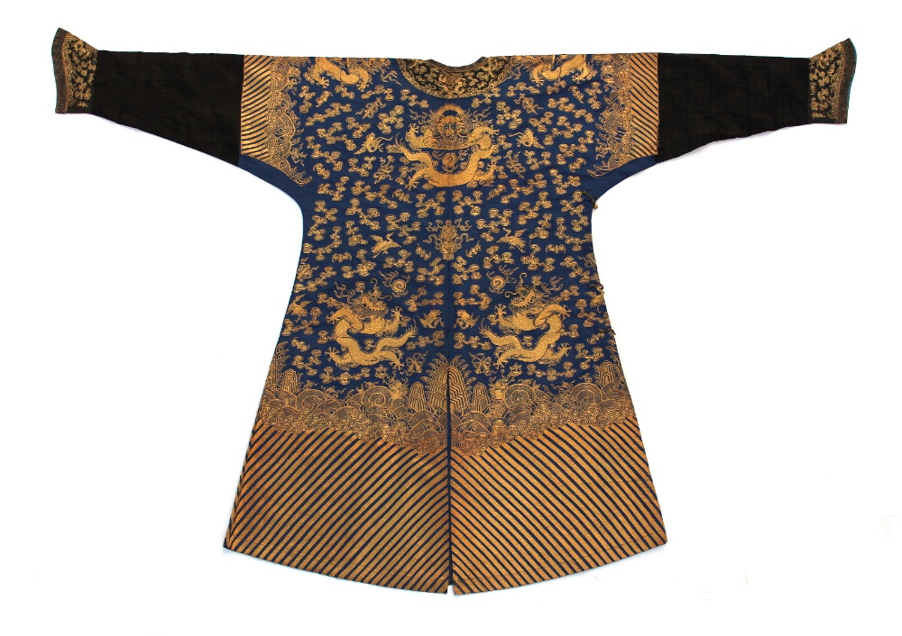 A Chinese blue silk dragon robe, late 19th / early 20th century, worked in couched gold threads with - Image 2 of 2