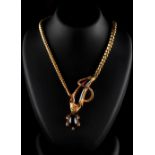 A good early Victorian yellow gold garnet necklace modelled as a snake chasing a turtle, circa 1845,