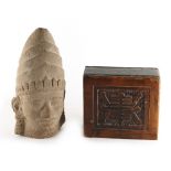 A fragmentary stone Buddha head, 11.6ins. (29.5cms.) high; together with a wood block pillow with