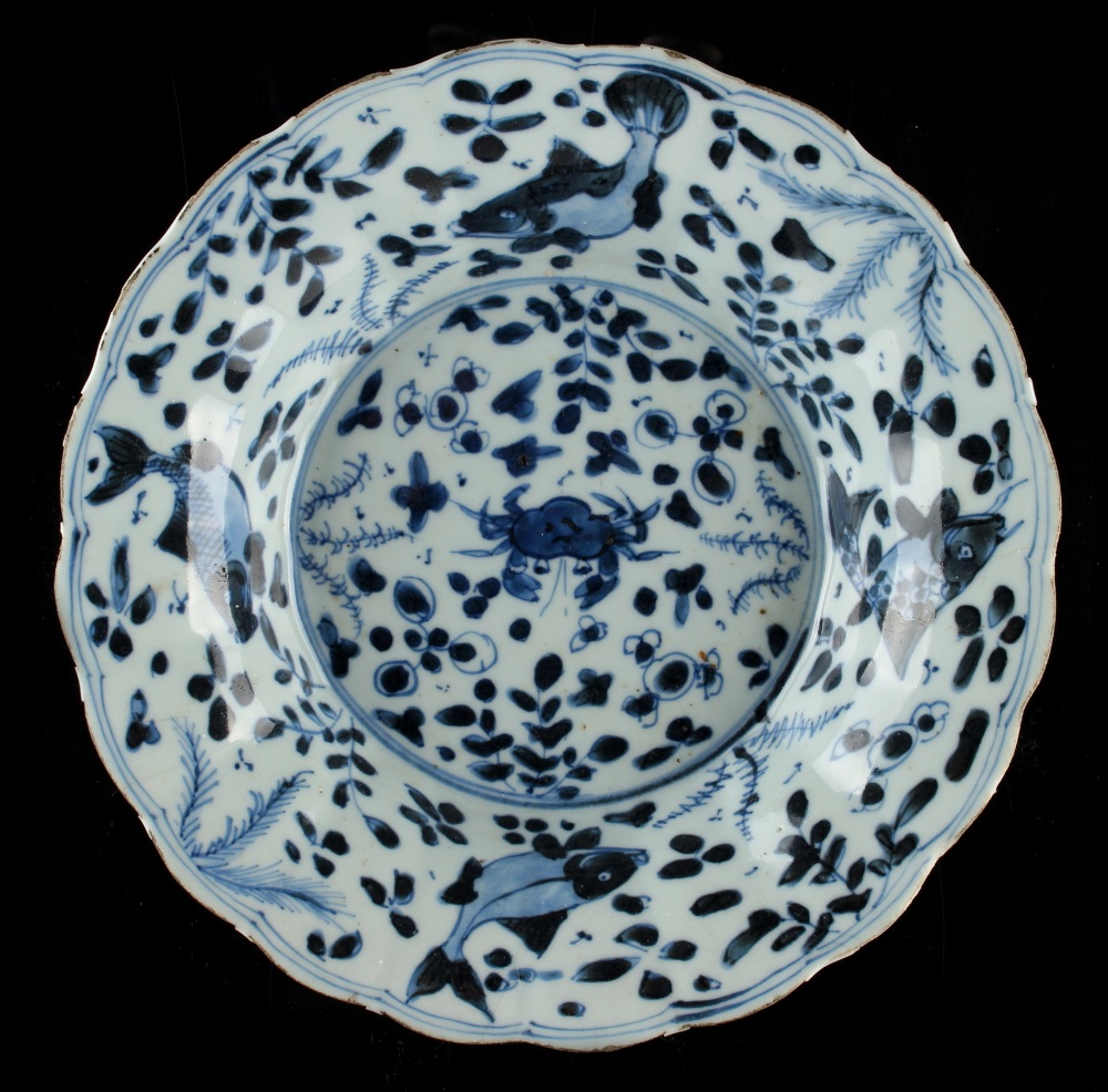 Property of a lady - a Chinese blue & white petal rimmed dish, Kangxi period (1662-1722), painted