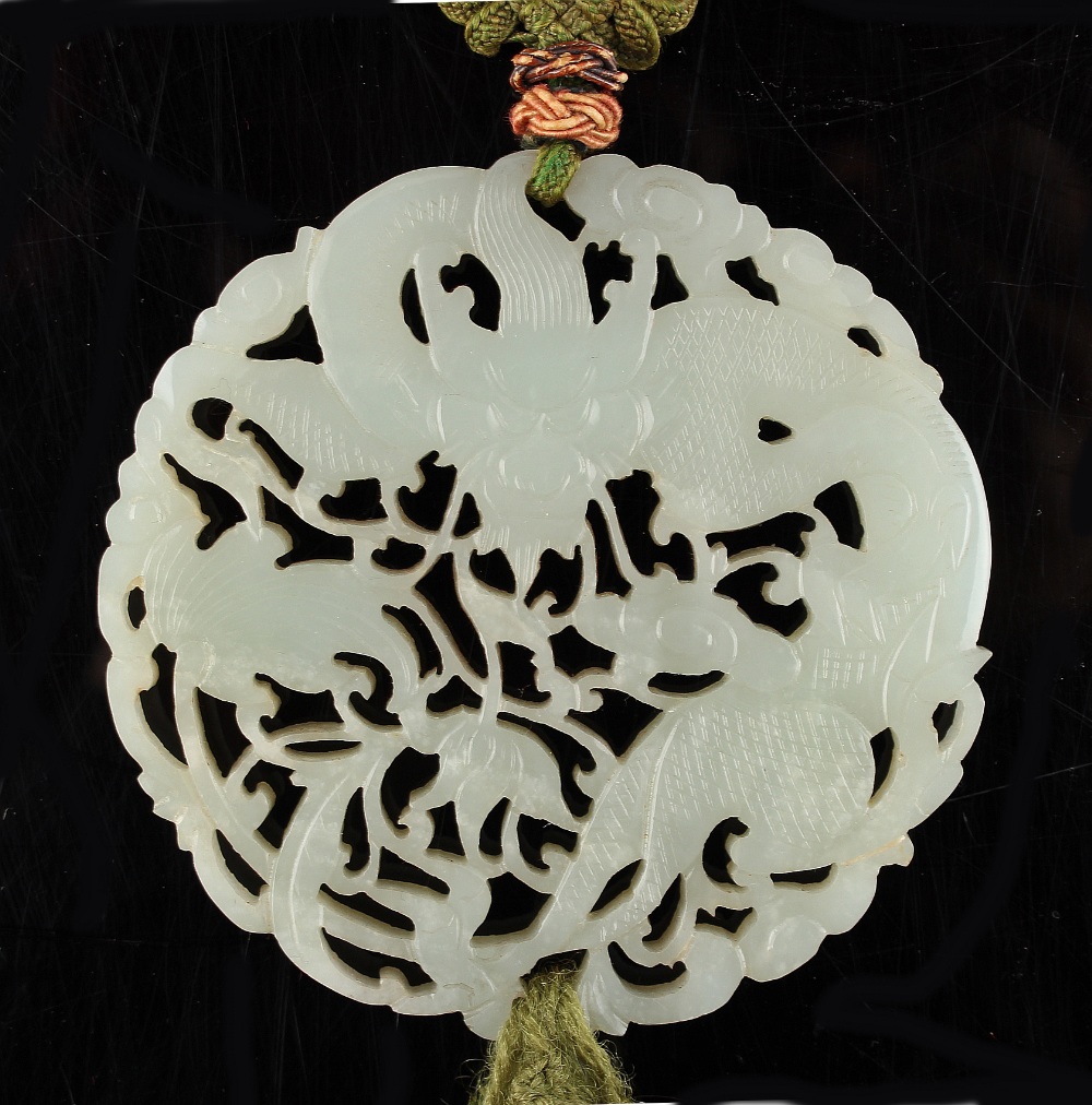 A Chinese carved very pale celadon jade dragon pendant ornament, 19th century, the carved & - Image 2 of 2