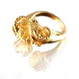 An 18ct yellow gold twin ram's head ring, possibly by Ilias Lalaounis, approximately 8.8 grams, size