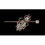 An unmarked gold diamond bug brooch, set with two Old European cut diamonds, eleven graduated rose