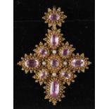 A late Georgian cannetille pink topaz & seed pearl pendant or brooch, circa 1820, the ten oval &
