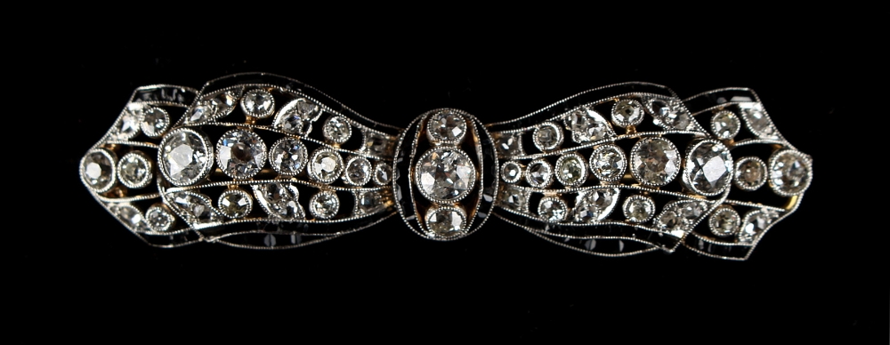 An Art Deco diamond & black onyx ribbon brooch, circa 1930, in yellow gold & platinum setting, 2. - Image 2 of 2