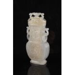 A Chinese carved agate baluster vase & cover of rectangular section with ring handles, probably