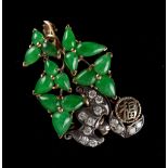 A Chinese Imperial jadeite & diamond brooch modelled as stylised leaves flanked by a diamond set bat