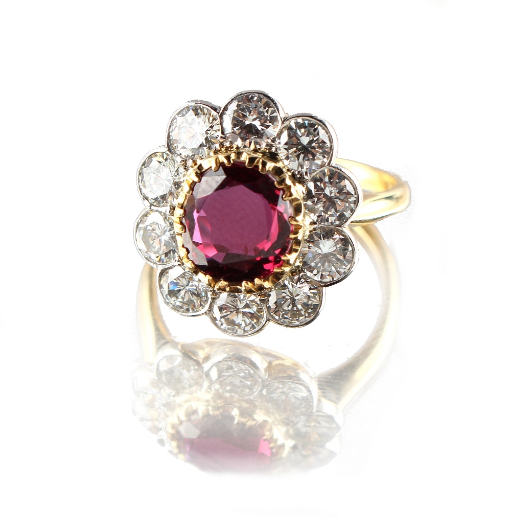 A fine 18ct yellow gold ruby & diamond flowerhead cluster ring, the certificated untreated Thai oval