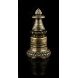 A Tibetan bronze stupa, 13th / 14th century, of Kadampa form, 7.8ins. (19.7cms.) high (see