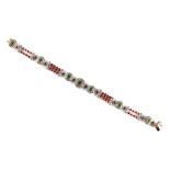A ruby emerald & diamond link bracelet, with alternating two & three row strings of round cut rubies