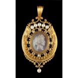 A good Victorian yellow gold carved hardstone cameo pendant, the oval cameo carved in high relief