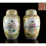 A pair of Chinese famille rose yellow ground ovoid ginger jars & covers, 20th century, iron red