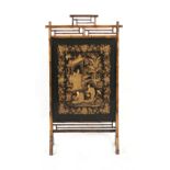 A late 19th / early 20th century bamboo screen, the Chinese silk panel worked in couched gold