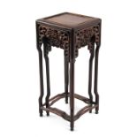 A nest of two Chinese carved hongmu square topped stands or occasional tables, circa 1900, the