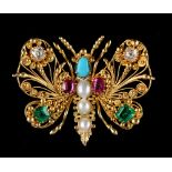 A good late Georgian cannetille ruby emerald diamond turquoise & pearl butterfly brooch, circa