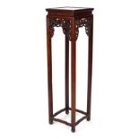A tall Chinese hongmu stand, late 19th / early 20th century, the square top inset with a burr wood