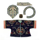 An early 20th century Chinese navy blue silk jacket, decorated with bats, butterflies,