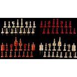 A private collection of chess sets - a red stained & natural bone chess set, the kings 4ins. (