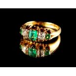 Property of a lady - a late Victorian unmarked high carat yellow gold emerald & diamond five stone