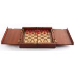 A private collection of chess sets - a folding travelling chess set in mahogany case, stamped H.D.S.