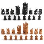 A private collection of chess sets - an Indian carved wood chess set, the kings 4.8ins. (12.5cms.)