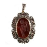 A carved hardstone oval intaglio pendant depicting a standing classical lady, the pierced setting