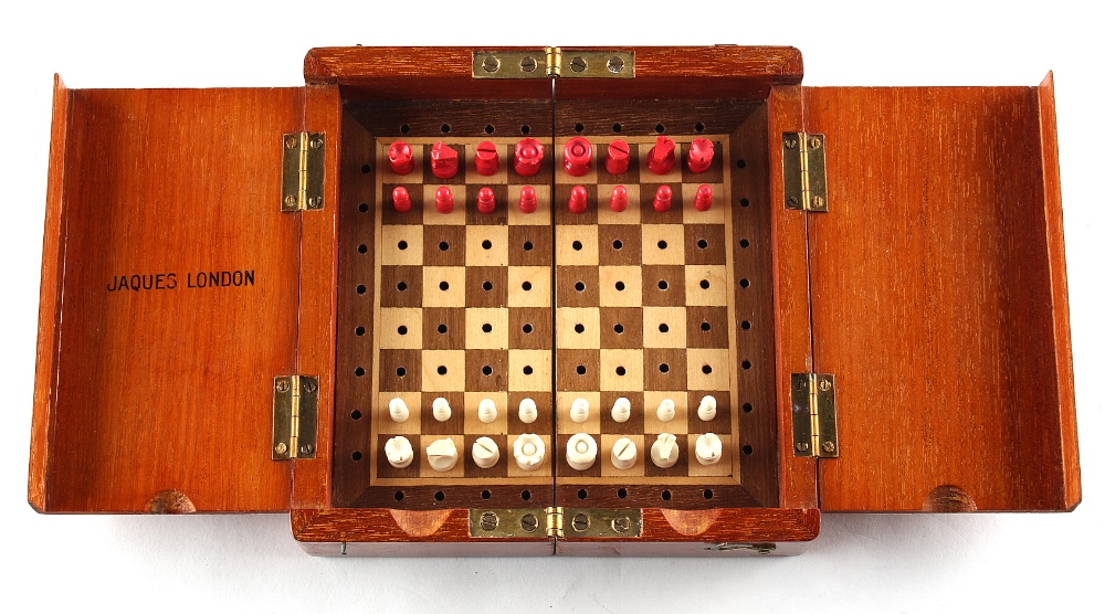 A private collection of chess sets - a Jaques London folding travelling chess set with red stained &