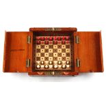 A private collection of chess sets - a Jaques London folding travelling chess set with red stained &