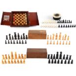 A private collection of chess sets - a folding travelling chess set in mahogany case with red