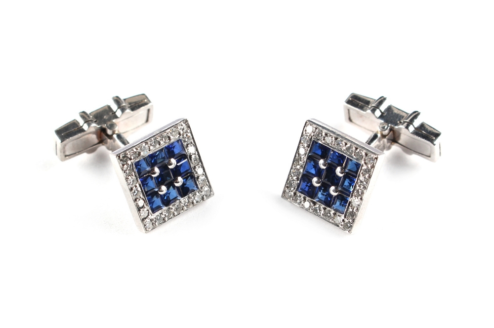 A good pair of 18ct white gold sapphire & diamond cufflinks, each set with twelve square cut