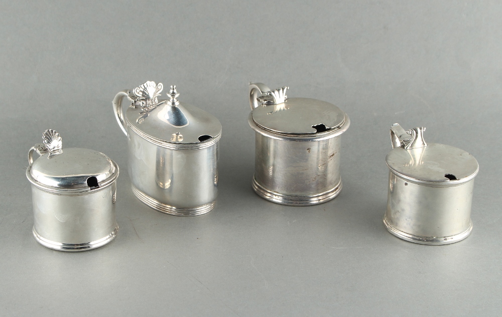 Property of a lady - four early 20th century silver mustard pots including an Edwardian silver