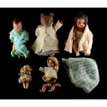 Property of a lady - four dolls including bisque headed examples; together with a vintage teddy bear